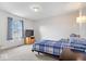 Cozy bedroom with plush carpeting and chair for relaxing at 4223 W State Road 234, McCordsville, IN 46055