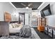 Beautiful bedroom features a barn door to ensuite and customized closet storage at 4223 W State Road 234, McCordsville, IN 46055