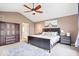 Primary bedroom featuring a ceiling fan and ensuite bathroom at 4223 W State Road 234, McCordsville, IN 46055