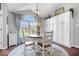 Cozy dining area featuring natural light, custom cabinets, and seating for four at 4223 W State Road 234, McCordsville, IN 46055