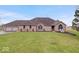 Charming brick home with a well-manicured lawn and a welcoming two-car attached garage at 4223 W State Road 234, McCordsville, IN 46055