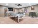 The basement offers a game room with ping pong, custom bar, and plenty of space for entertaining at 4223 W State Road 234, McCordsville, IN 46055