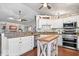 Bright kitchen featuring granite countertops, white cabinetry, and stainless steel appliances at 4223 W State Road 234, McCordsville, IN 46055