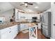 Updated kitchen with granite counters, stainless steel appliances, and custom tile backsplash at 4223 W State Road 234, McCordsville, IN 46055
