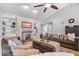 Relaxing living room with cozy couches and a decorative fireplace featuring built-in bookshelves on both sides at 4223 W State Road 234, McCordsville, IN 46055