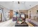 Inviting living room featuring exposed brick, vaulted ceiling, and comfortable seating arrangement at 4223 W State Road 234, McCordsville, IN 46055
