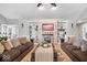 Inviting living room with cozy couches and a decorative fireplace featuring built-in bookshelves on both sides at 4223 W State Road 234, McCordsville, IN 46055