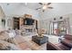 Cozy living room with a stone fireplace, vaulted ceilings, and comfortable seating, creating a welcoming atmosphere at 4223 W State Road 234, McCordsville, IN 46055