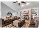 Spacious living room featuring built-in shelving, a cozy fireplace, and a comfortable seating arrangement for relaxation at 4223 W State Road 234, McCordsville, IN 46055