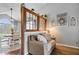 Comfortable living area with seating, stylish decor, and adjacent dining space at 4223 W State Road 234, McCordsville, IN 46055