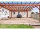 Charming brick patio with an outdoor cooking area, covered by a pergola, perfect for summer barbecues at 4223 W State Road 234, McCordsville, IN 46055
