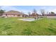 Backyard with a pool, lounge chairs, and a covered patio, perfect for outdoor entertaining and relaxation at 4223 W State Road 234, McCordsville, IN 46055