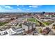 Condo building surrounded by city structures and large stadium, and a partly cloudy sky at 435 Virginia Ave # 402, Indianapolis, IN 46203