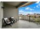 Spacious balcony offering a scenic city view, complete with comfortable seating and black iron railings at 435 Virginia Ave # 402, Indianapolis, IN 46203