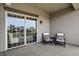 Cozy balcony features outdoor seating, a small table, and sliding glass doors offering cityscape views at 435 Virginia Ave # 402, Indianapolis, IN 46203