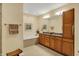 Bright bathroom features a dual sink vanity, soaking tub, and neutral tile flooring at 435 Virginia Ave # 402, Indianapolis, IN 46203
