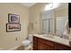 Updated bathroom featuring a sink vanity with a mirror and walk-in shower at 435 Virginia Ave # 402, Indianapolis, IN 46203