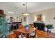 Dining area showcasing kitchen with bar seating, classic sideboard and wood flooring at 435 Virginia Ave # 402, Indianapolis, IN 46203