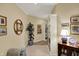 Hallway featuring tan walls, built-in shelving, and decoratively framed wall art at 435 Virginia Ave # 402, Indianapolis, IN 46203