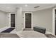 Neutral hallway featuring modern marble floors, brown doors, and a cushioned bench at 435 Virginia Ave # 402, Indianapolis, IN 46203