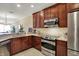 Spacious kitchen featuring stainless steel appliances, modern cabinetry, and granite countertops at 435 Virginia Ave # 402, Indianapolis, IN 46203