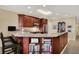 Kitchen with granite countertops, seating, and book shelves, lit by modern recessed lighting at 435 Virginia Ave # 402, Indianapolis, IN 46203