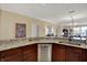 Kitchen featuring stainless steel appliances, dark wood cabinetry and granite countertops at 435 Virginia Ave # 402, Indianapolis, IN 46203
