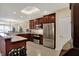 Modern kitchen featuring stainless steel appliances, dark wood cabinetry and an undermounted wine rack at 435 Virginia Ave # 402, Indianapolis, IN 46203