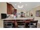 Kitchen with granite countertops and bar stool seating with an adjacent bookcase feature at 435 Virginia Ave # 402, Indianapolis, IN 46203