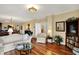 Spacious living room boasts hardwood floors, comfortable seating, and a view into other rooms at 435 Virginia Ave # 402, Indianapolis, IN 46203