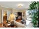 Inviting living room features hardwood floors, stylish decor, and a sliding glass door to a balcony at 435 Virginia Ave # 402, Indianapolis, IN 46203