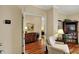 Charming living room with hardwood floors, a view into another room, and a built-in bookcase at 435 Virginia Ave # 402, Indianapolis, IN 46203