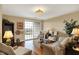Living room featuring hardwood floors, comfortable seating, and natural light from sliding doors at 435 Virginia Ave # 402, Indianapolis, IN 46203