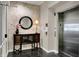 Entrance area featuring a decorative console table, mirror, and elevator at 435 Virginia Ave # 402, Indianapolis, IN 46203