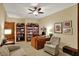 Bright office area features built-in shelving, cabinets, and desk with comfortable seating at 435 Virginia Ave # 402, Indianapolis, IN 46203