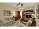 Office features hardwood furniture, a beige sofa and chair, and a ceiling fan at 435 Virginia Ave # 402, Indianapolis, IN 46203