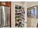Walk-in pantry stocked with various food items and household essentials at 435 Virginia Ave # 402, Indianapolis, IN 46203