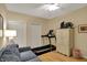 Versatile spare room with a sleeper sofa, closet, treadmill, and storage cabinet at 435 Virginia Ave # 402, Indianapolis, IN 46203