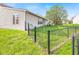 This backyard has a chain link fence and mature trees at 448 Yorktown Ln, Avon, IN 46123