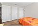 Bedroom featuring hardwood floors, three white doors, and minimalist decor at 448 Yorktown Ln, Avon, IN 46123