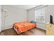 Cozy bedroom with hardwood floors, natural light from the window, and minimalist decor at 448 Yorktown Ln, Avon, IN 46123
