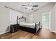 This bedroom features hardwood floors, a ceiling fan, and stylish furniture at 448 Yorktown Ln, Avon, IN 46123