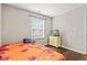 Well-lit bedroom features hardwood floors, a window with blinds, and a neutral color scheme at 448 Yorktown Ln, Avon, IN 46123