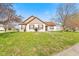 Charming home featuring a well-manicured front yard with blooming flowers and mature trees, inviting and picturesque at 448 Yorktown Ln, Avon, IN 46123