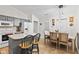 Eat-in kitchen features stainless steel appliances, an island, and a dining table with seating at 448 Yorktown Ln, Avon, IN 46123
