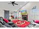 An open-concept living room with gray sliding doors and fireplace at 448 Yorktown Ln, Avon, IN 46123