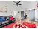 Comfortable living room with vaulted ceiling, ceiling fan, and gray sliding doors leading into the bedroom at 448 Yorktown Ln, Avon, IN 46123