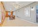Bright sunroom with wood and gray paneled walls, multiple windows and tile floor at 448 Yorktown Ln, Avon, IN 46123