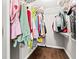 Organized walk-in closet featuring built-in shelving and hardwood floors, providing ample storage space at 448 Yorktown Ln, Avon, IN 46123
