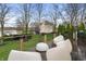 Spacious back deck with modern outdoor seating and a beautiful view of the lake at 4561 Coles Dr, Columbus, IN 47201